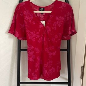 It's a gorgeous tieback blouse. Super soft! Brand new with tags